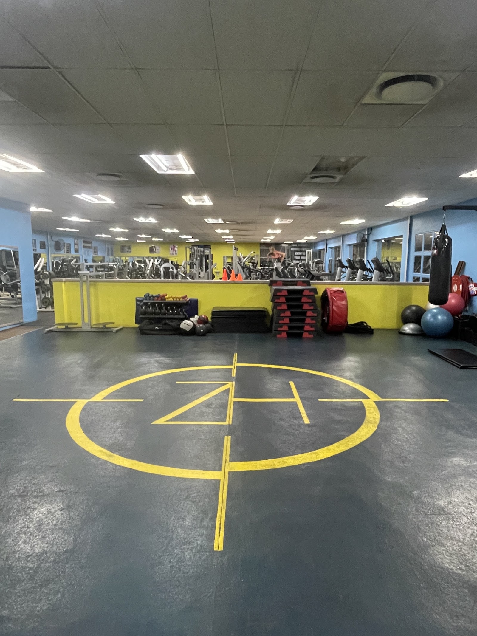Open gym floor with the Health Zone Gym logo